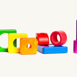 Different coloured wooden pieces from the Bajo tower puzzle stacker set 