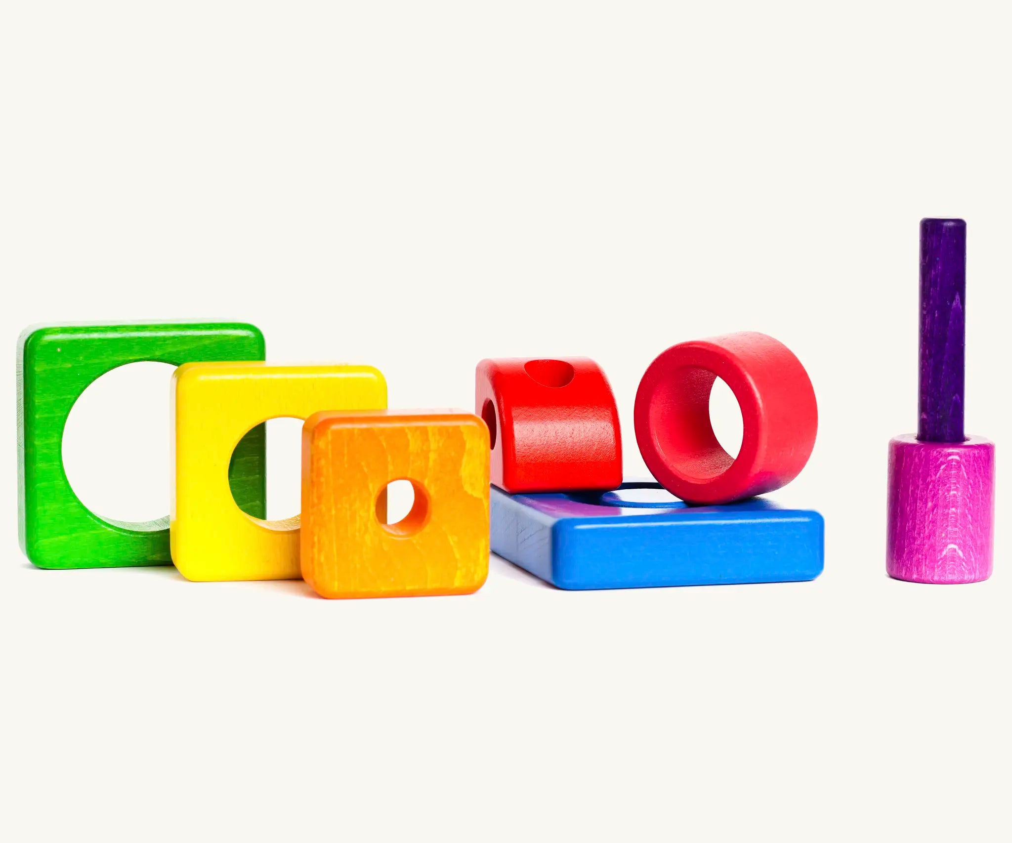 Different coloured wooden pieces from the Bajo tower puzzle stacker set 