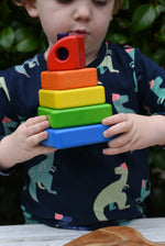 Child holding the Bajo Puzzle Stacker Tower in his hands.