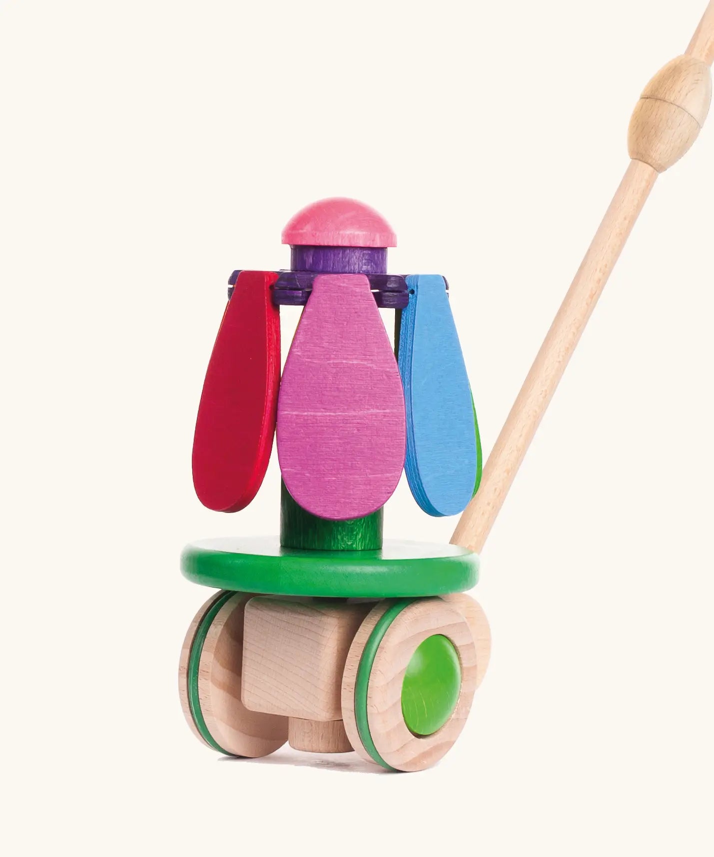 Bajo wooden rainbow flower push along toy showing the coloured petals fully closed and pointing down