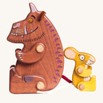 The Bajo Gruffalo & Mouse Figures Set figures are sitting down together back to back. The brown Gruffalo is on the left, and the yellow Mouse is on the right