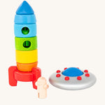 The Bajo Alien Flying Saucer has landed next to a rainbow Bajo Rocket. The green alien is inside the astronaut's rainbow rocket and the astronaut is stood outside