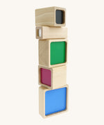 A tower stack made Bajo squaremide sensory wooden blocks available at Babipur. Each block is showing its coloured base.