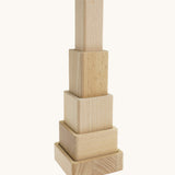 A pyramid stack made from the Bajo squaremide sensory wooden blocks available at Babipur. 