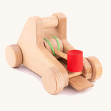 The back of the A Bajo wooden catapult toy set available available at Babipur. showing the elastic pull back system 