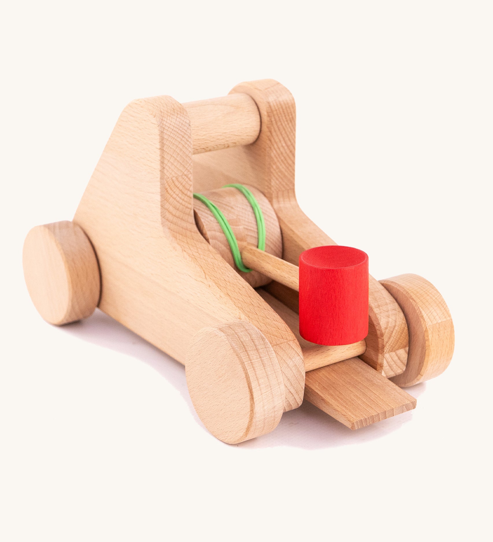 The back of the A Bajo wooden catapult toy set available available at Babipur. showing the elastic pull back system 