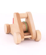 A front view of the A Bajo wooden catapult toy set available available at Babipur showing the elastic catapult system fully pulled back