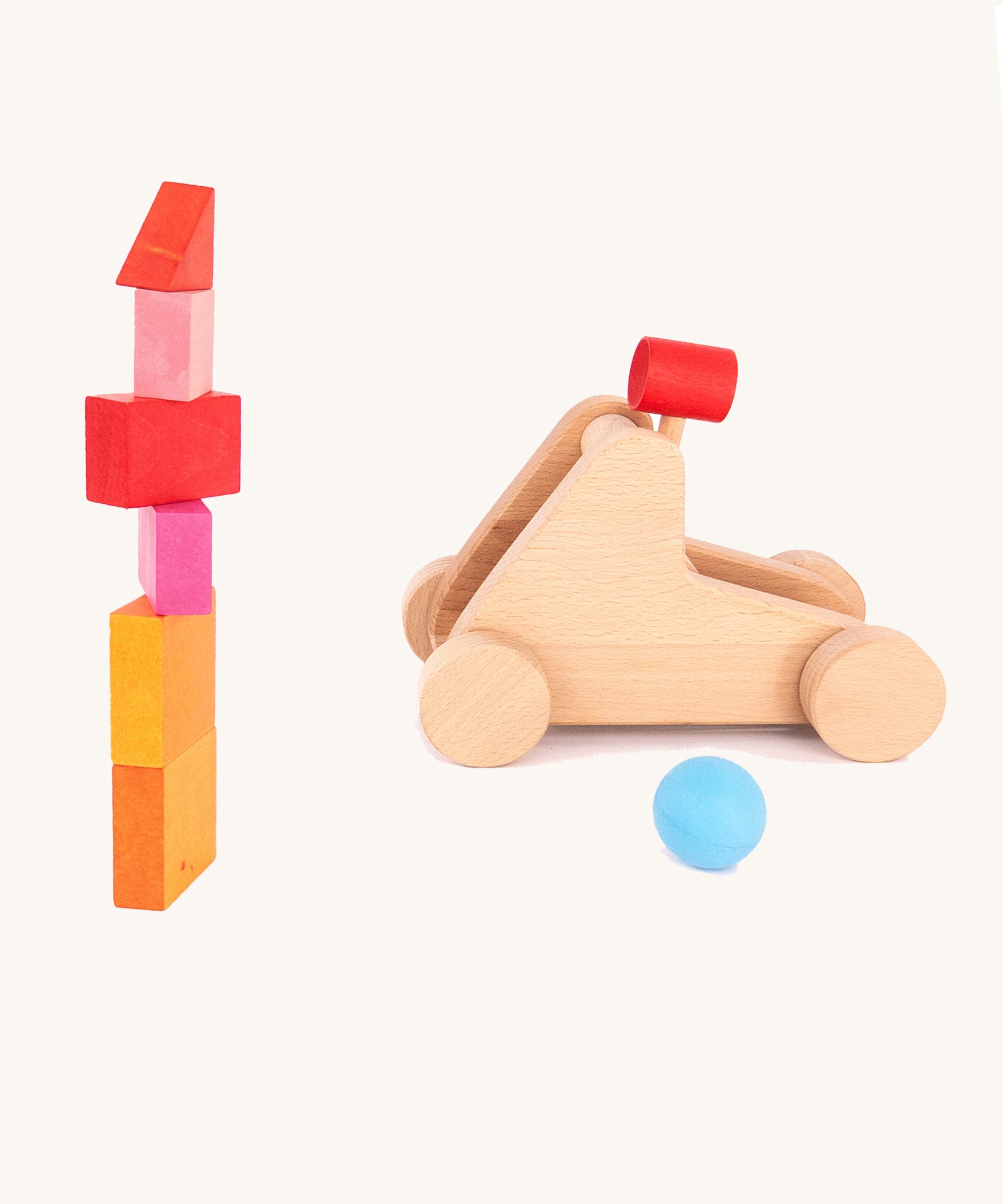 A simple block stack with the Bajo wooden catapult toy set available available at Babipur ready to shoot down the tower. 