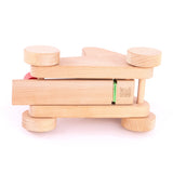 The underside of the Bajo wooden catapult toy set available available at Babipur showing the catapult's base and wheels