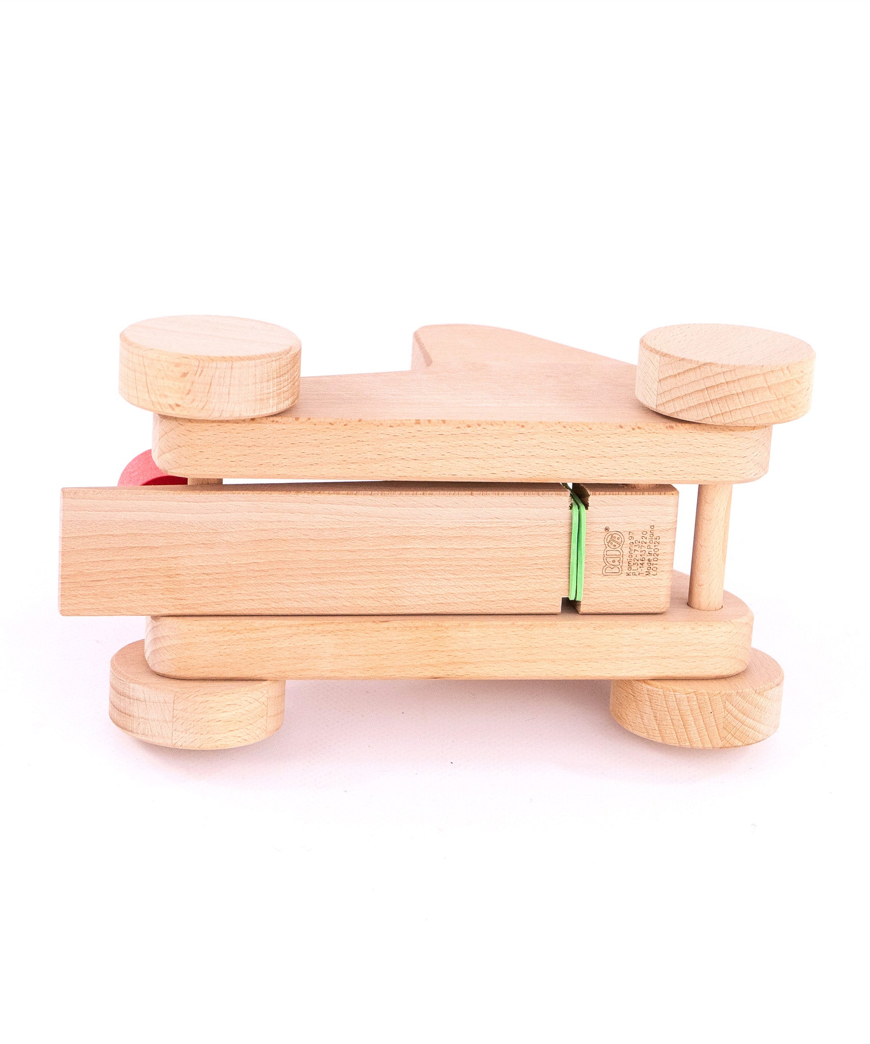 The underside of the Bajo wooden catapult toy set available available at Babipur showing the catapult's base and wheels