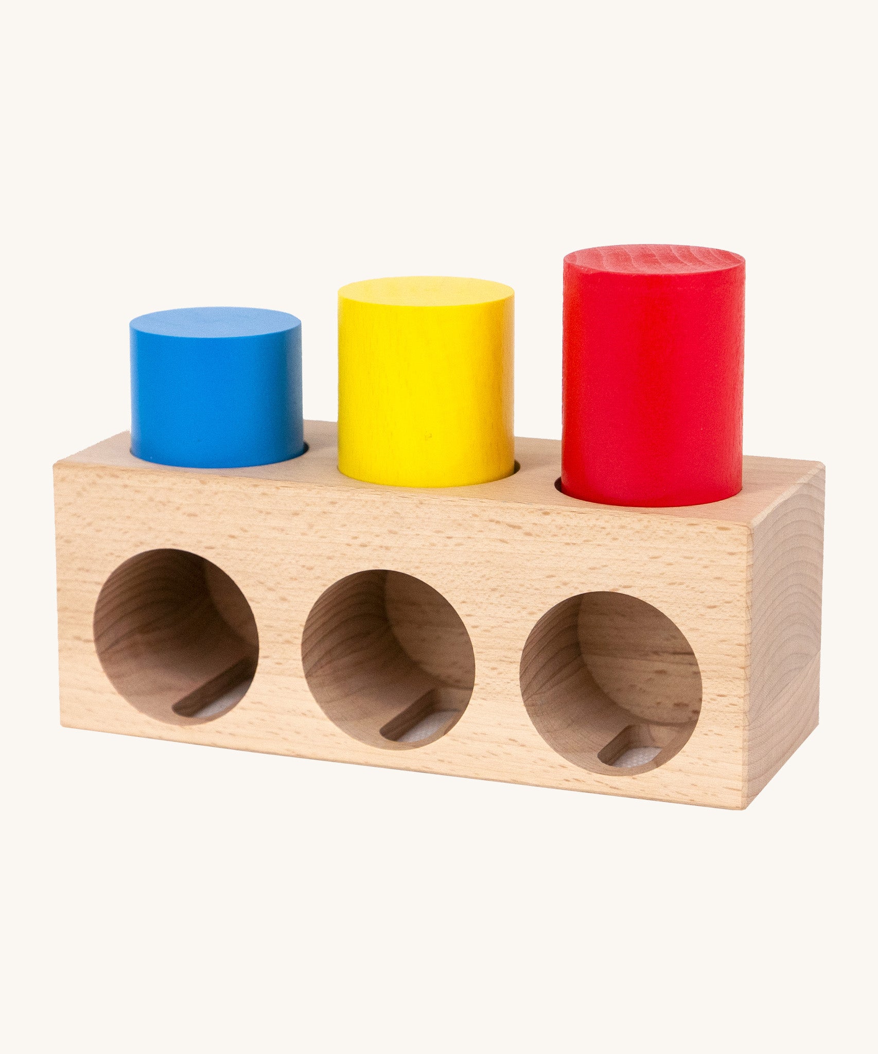 Bajo deep and shallow shape sorter puzzle set available at Babipur. The rectangular shape wooden base has the 3 coloured tubes inside the shallow cut outs