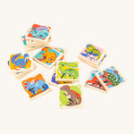 Bajo Dinosaur Memory Game square blocks, stacked on top of each other showing the dinosaur pictures on one side of the blocks, on a cream background