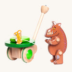 The Wooden Gruffalo figure is stood next to the Bajo Gruffalo & Mouse Push Along Toy and is looking at the mouse