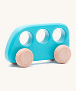 A Bajo wooden light blue bus available at Babipur. Features 3 circular windows for easy handling and unpainted wheels