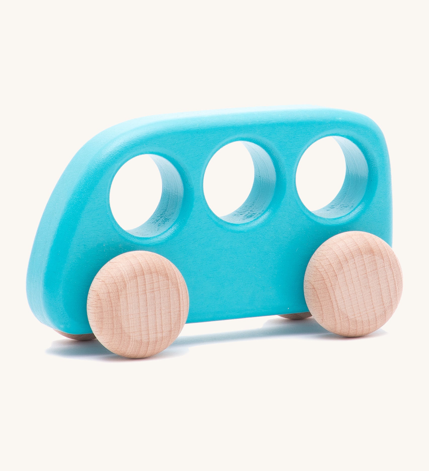 A Bajo wooden light blue bus available at Babipur. Features 3 circular windows for easy handling and unpainted wheels