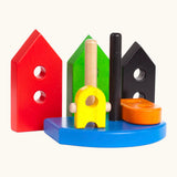Wooden pieces from the Bajo nemo stacker standing upright showing holes on the pieces