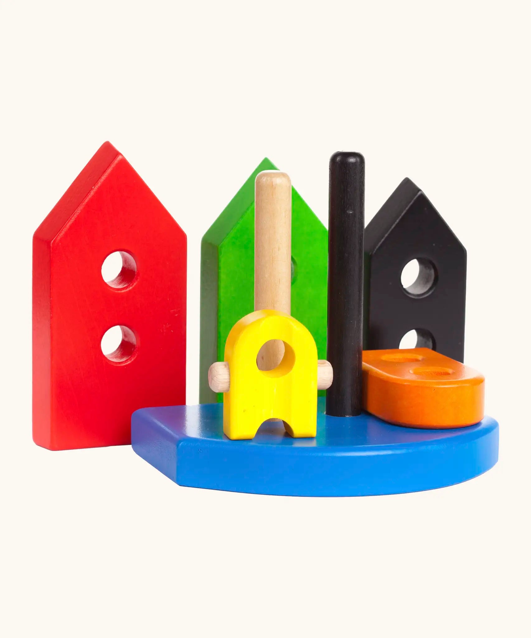 Wooden pieces from the Bajo nemo stacker standing upright showing holes on the pieces