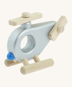 A Bajo wooden police helicopter available at Babipur. This helicopter is silver with movable propellors.