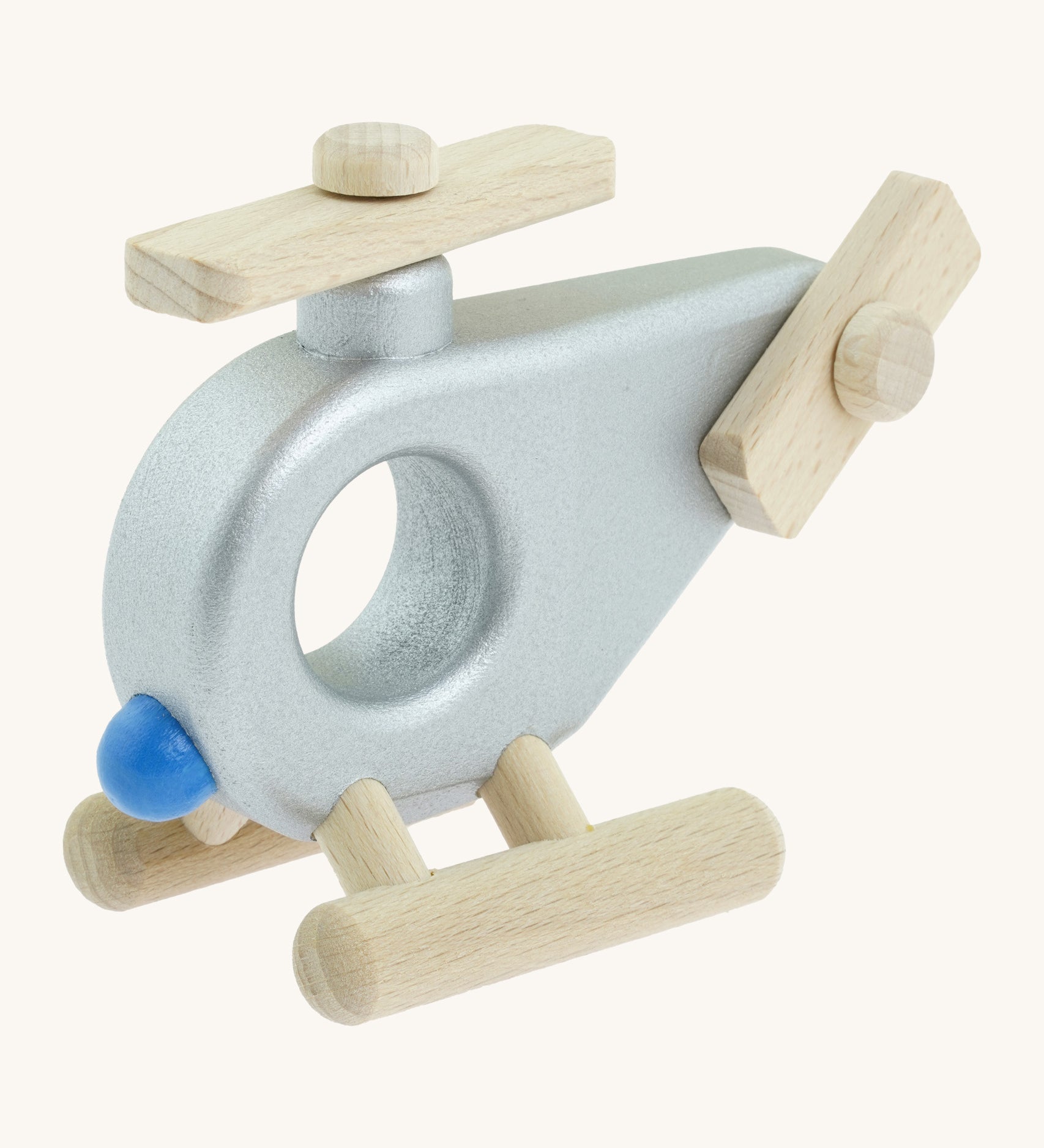 A Bajo wooden police helicopter available at Babipur. This helicopter is silver with movable propellors.