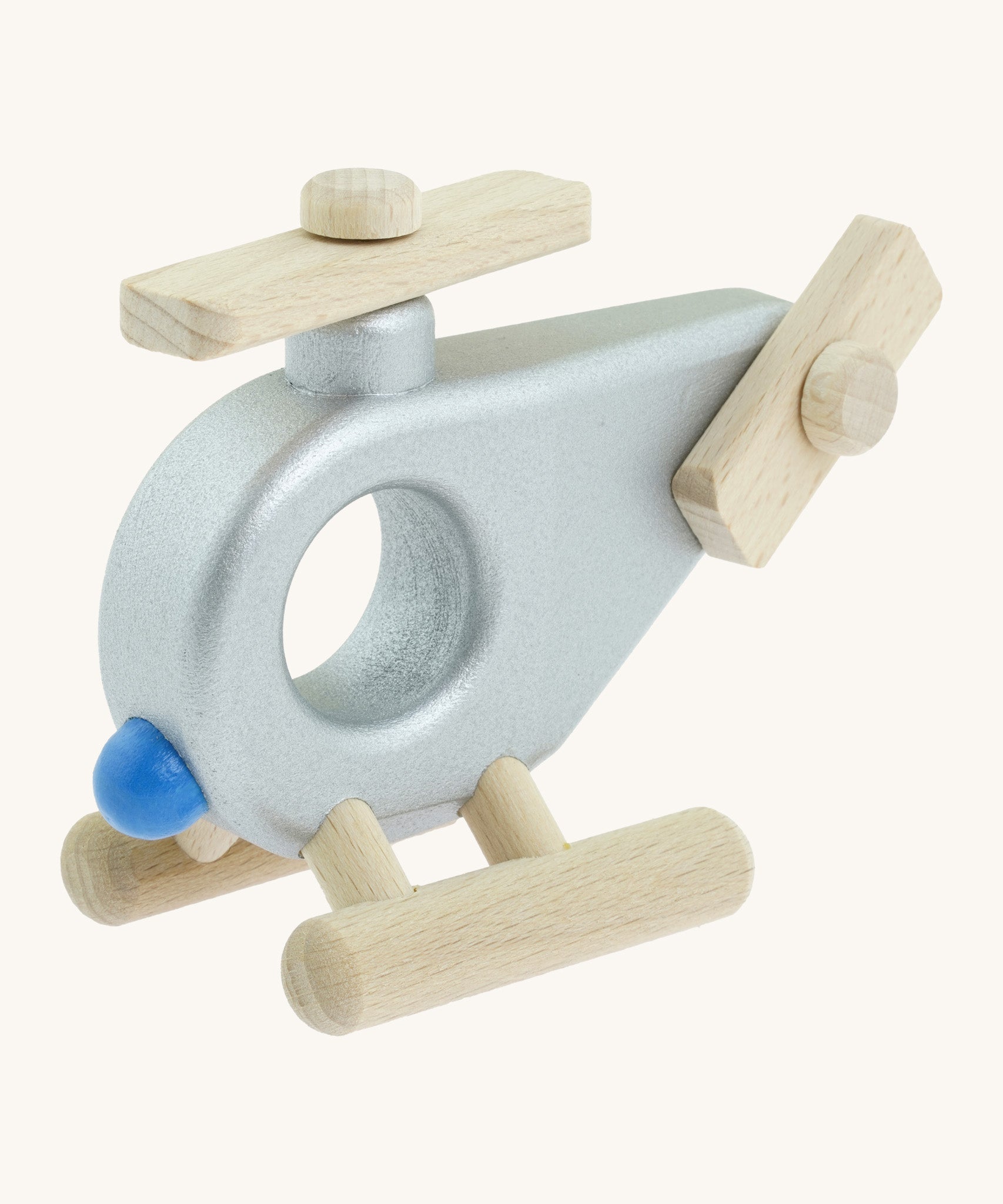 A Bajo wooden police helicopter available at Babipur. This helicopter is silver with movable propellors.