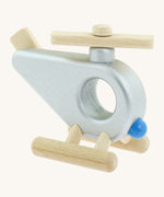 A side photo of the Bajo wooden police helicopter available at Babipur. This helicopter is silver with movable propellors and a circular window 