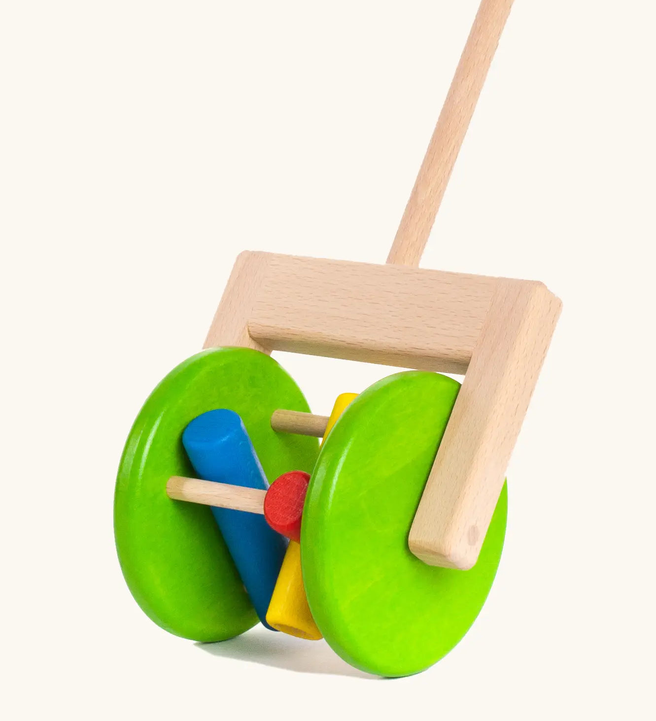 Large green wooden wheels with cylinder rattles on the Bajo rattle push along toy