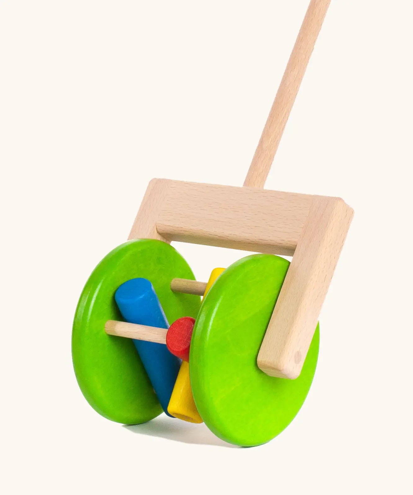 Large green wooden wheels with cylinder rattles on the Bajo rattle push along toy