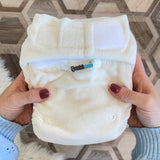 Bambinex newborn and baby Bamboo cloth nappy in hands, fits up to 20lbs, sold at Babipur.
