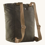 The back of the Patagonia Waxed Canvas Tote Pack Basin Green, showing the shoulder straps