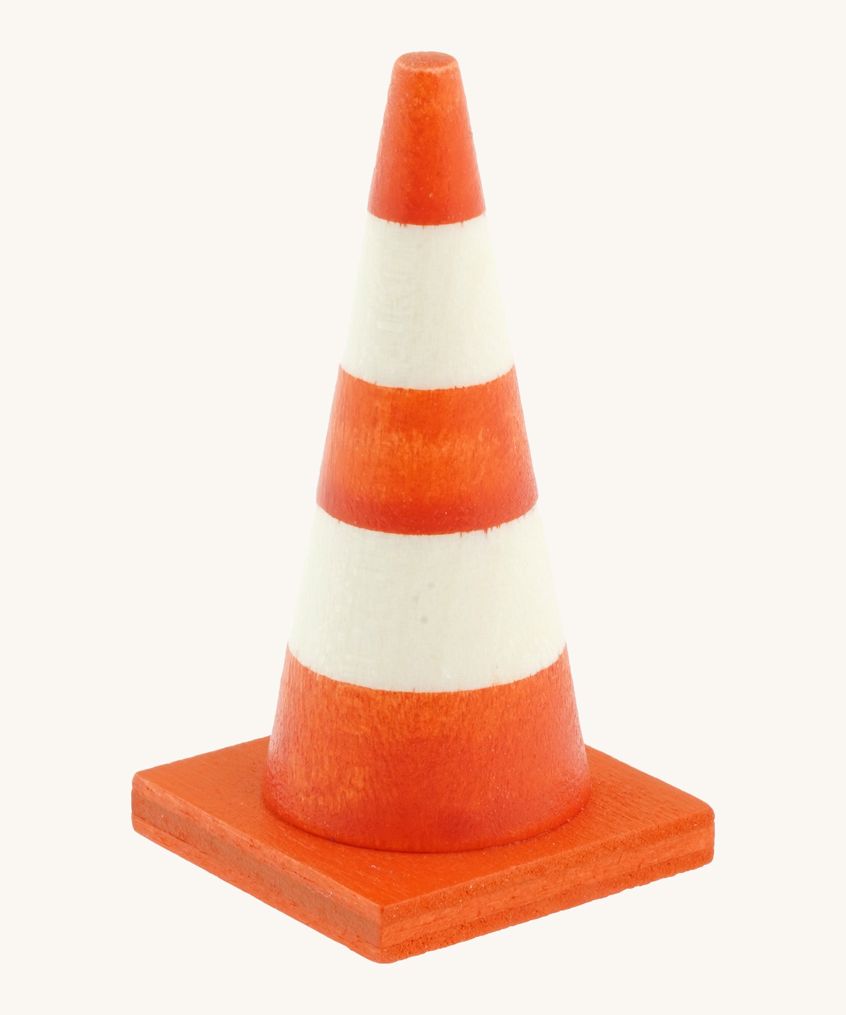 Beck mini wooden traffic cone available at Babipur. This triangular cone has a square base and hand painted in bright orange and white stripes
