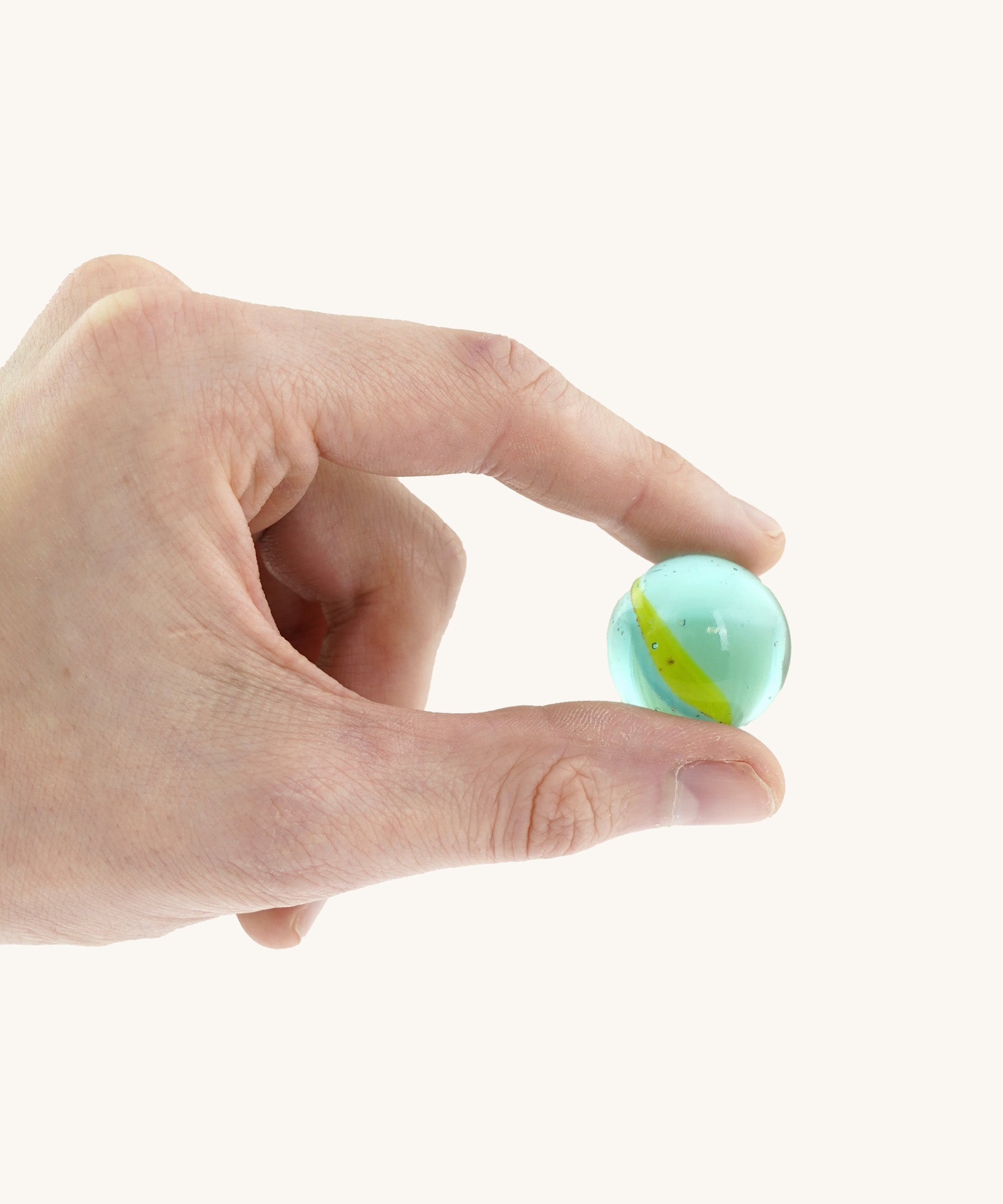 A close up of the marble from the Beck coloured roller cup marble run set available at Babipur showing scale