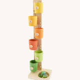 A Beck coloured roller cup marble run available at Babipur. A tower style marble run set with 6 lightly coloured tilting cups and 3 big marbles.