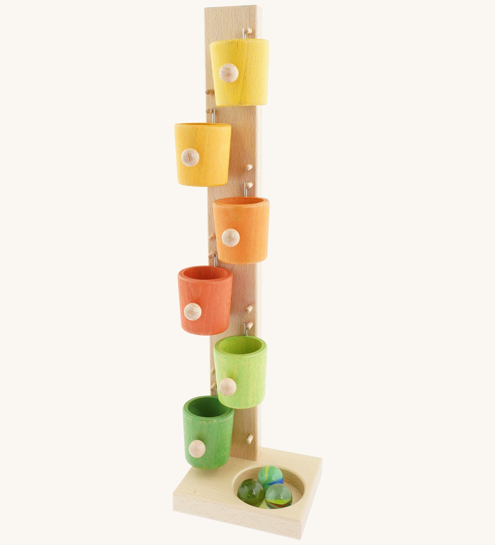 A Beck coloured roller cup marble run available at Babipur. A tower style marble run set with 6 lightly coloured tilting cups and 3 big marbles.