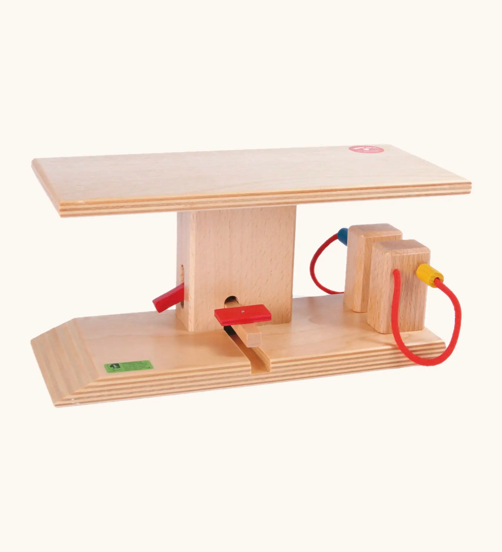 Beck wooden gas station play set showing 2 gas pumps and ramp with a red riser lever.