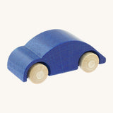 Beck wooden speedy race car toy in blue available at Babipur. This wooden car toy is in a classic beetle shape with a blue body and unpainted wheels