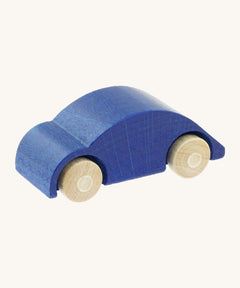 Beck wooden speedy race car toy in blue available at Babipur. This wooden car toy is in a classic beetle shape with a blue body and unpainted wheels