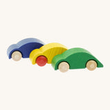 A row of Beck wooden speedy race car toys in blue, yellow and green available at Babipur. 