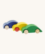 A row of Beck wooden speedy race car toys in blue, yellow and green available at Babipur. 