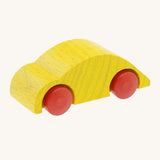 Beck wooden speedy race car toy in yellow available at Babipur. This wooden car toy is in a classic beetle shape with a yellow body and red wheels