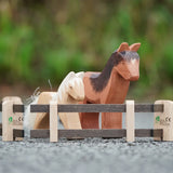 Beck Holzspielzeug wooden toy fence pieces set up as a small-world play pen with Ostheimer wooden horse figures.