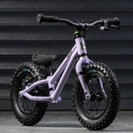 A closer look at the Early Rider Big Foot Balance Bike - Violet Haze, stood in front of a grey background and is on light grey flooring