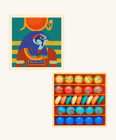 Billes & Co Horus mini marble box available at Babipur. A box of 29 marbles and pebbles in Horus inspired colours. Set comes in a cardboard box with a Horus god on the front.