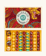 Billes and Co glass marbles Japan Dragon Yuzu in red, yellow and blue - a mix of large, standard and flat marbles in a dragon gift box.