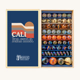 Billes & Co Cali Karma Marbles Box - 56 Pack. A selection of round and flat marbles in various shades of orange, grey, brown, beige and metallic