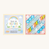 Billes & Co Encore Une Histoire Marbles Box - 29 Pack. A selection of round and flat marbles in pink,blue, orange, green. With clear and frosted light blue marbles