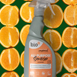 Bio-d 500ml all purpose sanitiser spray in mandarin laid on slicer of mandarin. This sanitiser spray is available at Babipur.