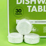 A close up of 3 Bio-D dishwasher tablets, showing the water soluble film holding the tablet. These dishwasher tablets are available at Babipur.