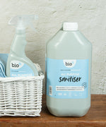 A close up of the 5L bottle of Bio-D all purpose sanitiser refill in fragrance free next to a 500ml bottle, both available at Babipur.