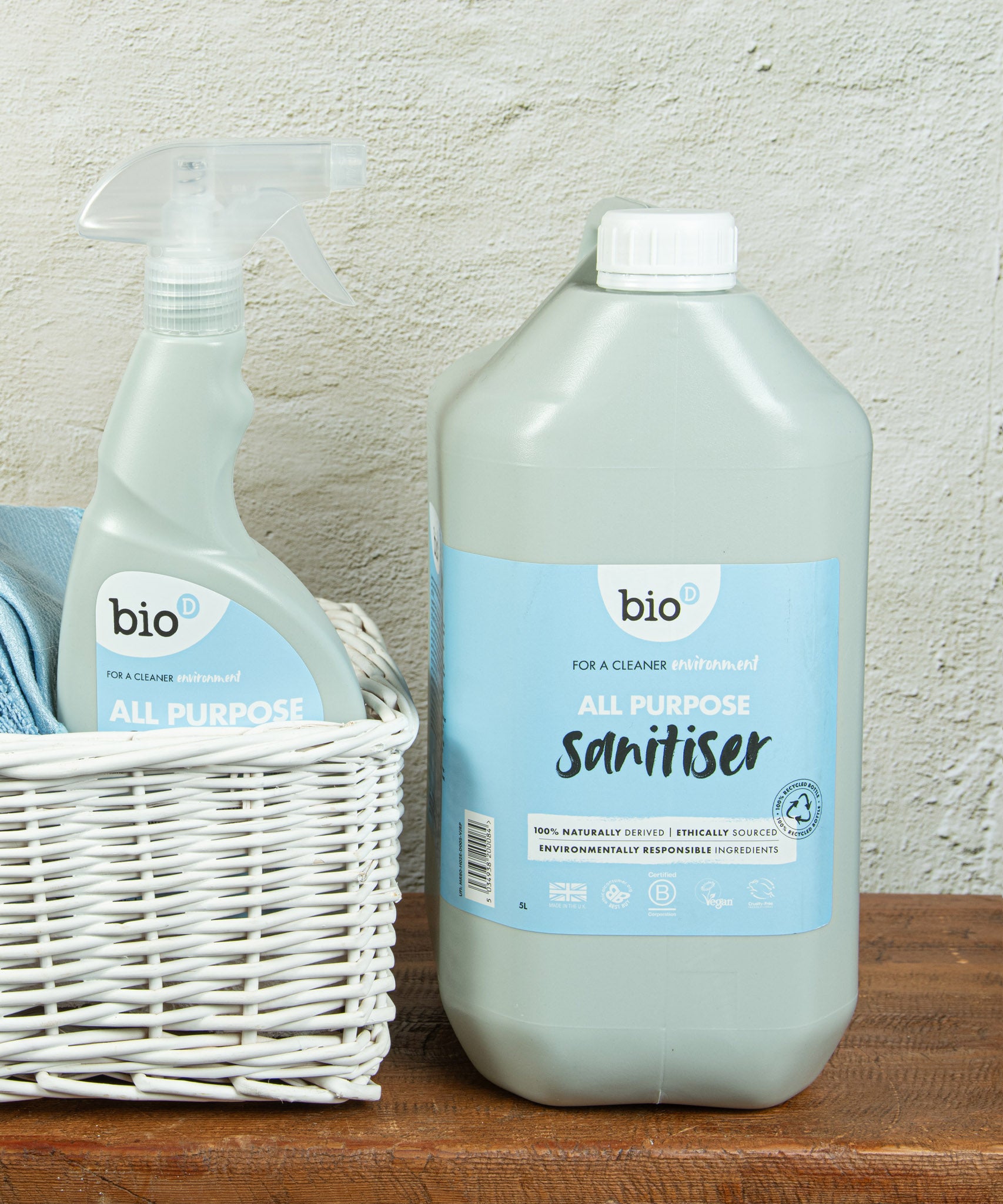 A close up of the 5L bottle of Bio-D all purpose sanitiser refill in fragrance free next to a 500ml bottle, both available at Babipur.
