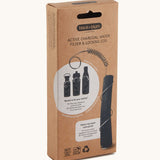 A close up of the brown cardboard packaging holding the Black + Blum active charcoal water filter with metal coil 